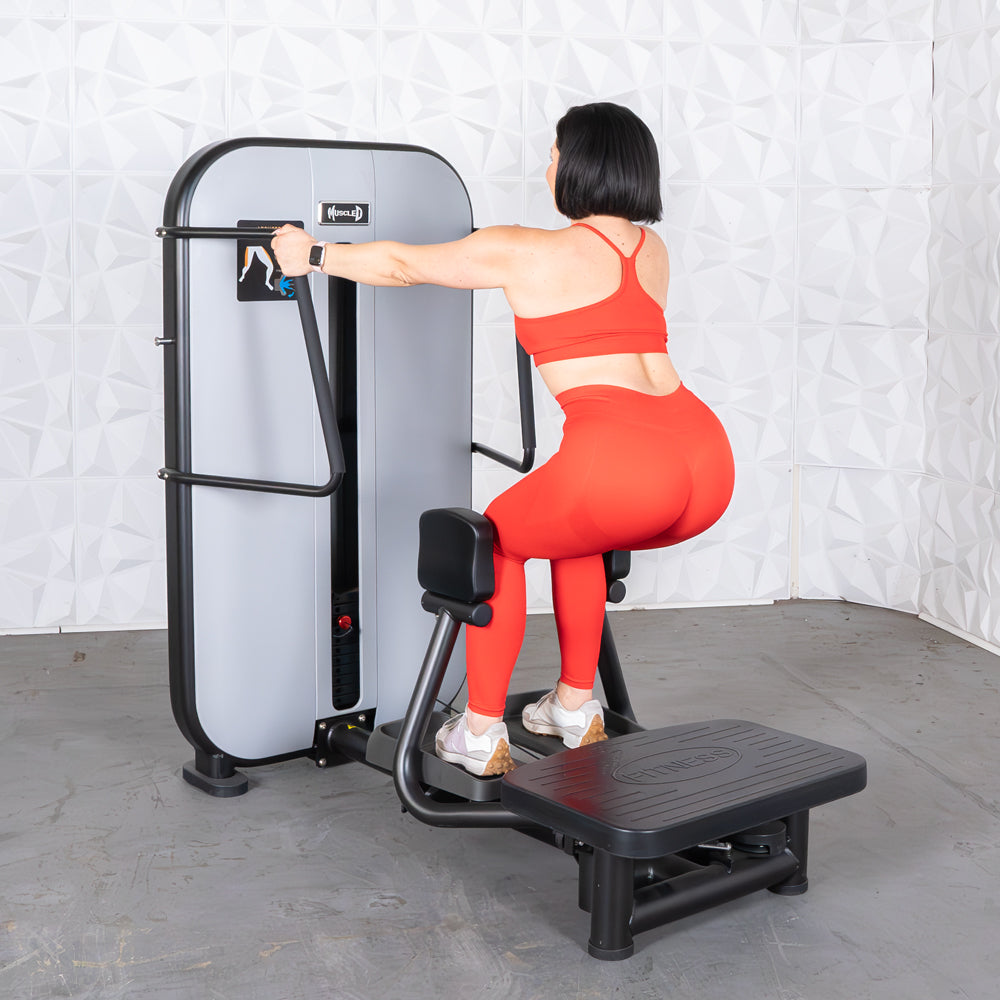 commercial grade black and white selectorized standing abductor machine