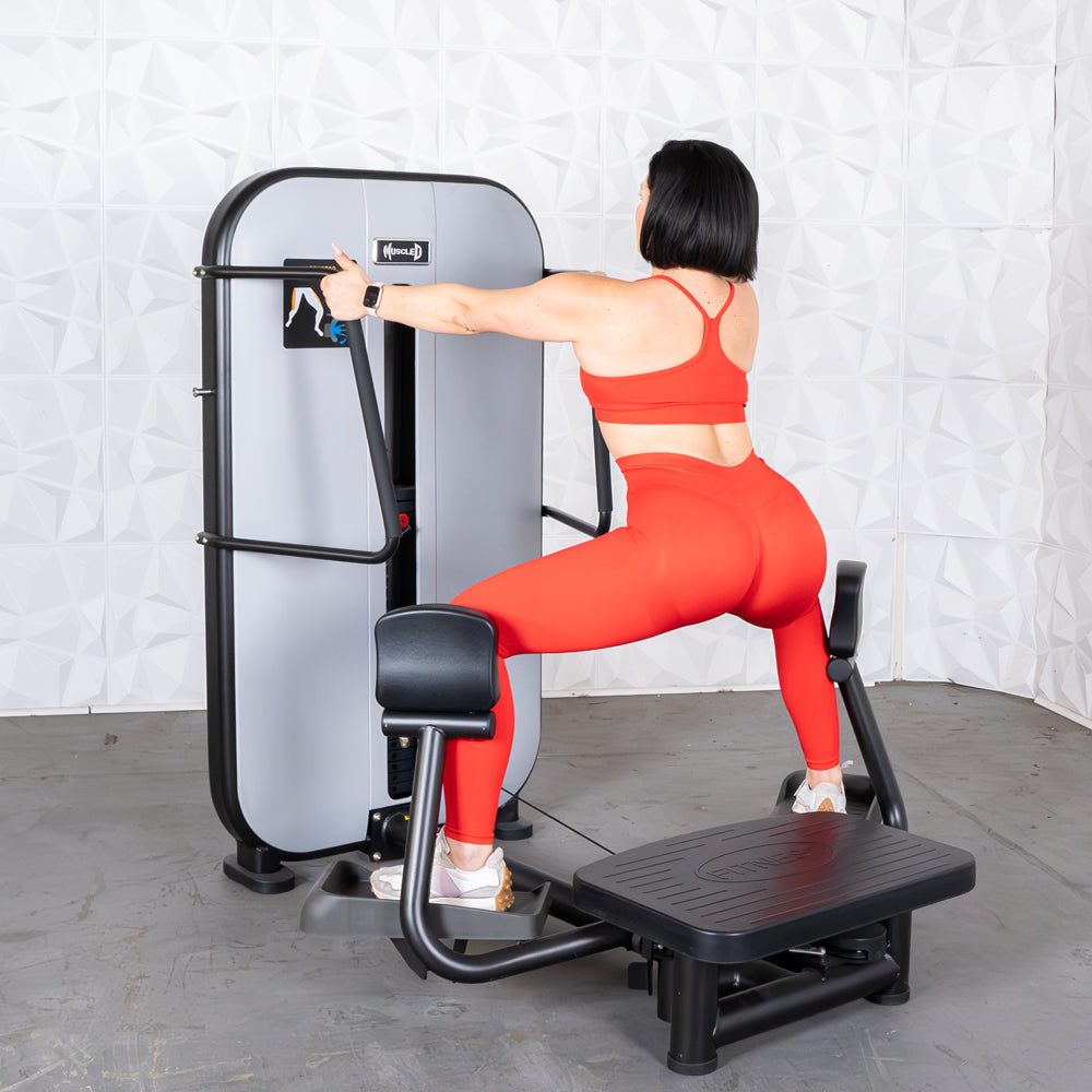 commercial grade black and white selectorized standing abductor machine